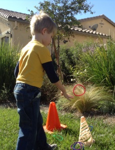 When studying the letter R, Kona had to say a word with the "r" sound before he could toss a ring over a cone.