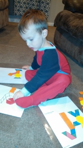 Tahoe was eager to use his pattern blocks on pre-made mats to make Nativity scenes.